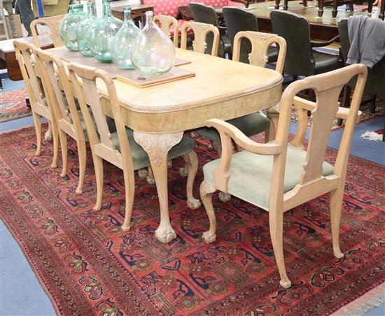 A Queen Anne style figured walnut dining table and eight dining chairs (two with arms) table L.210cm